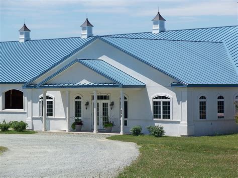 white house blue metal roof|houses with white metal roofs.